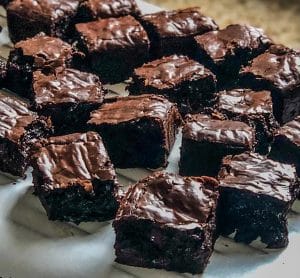 a group of brownies on a white plate