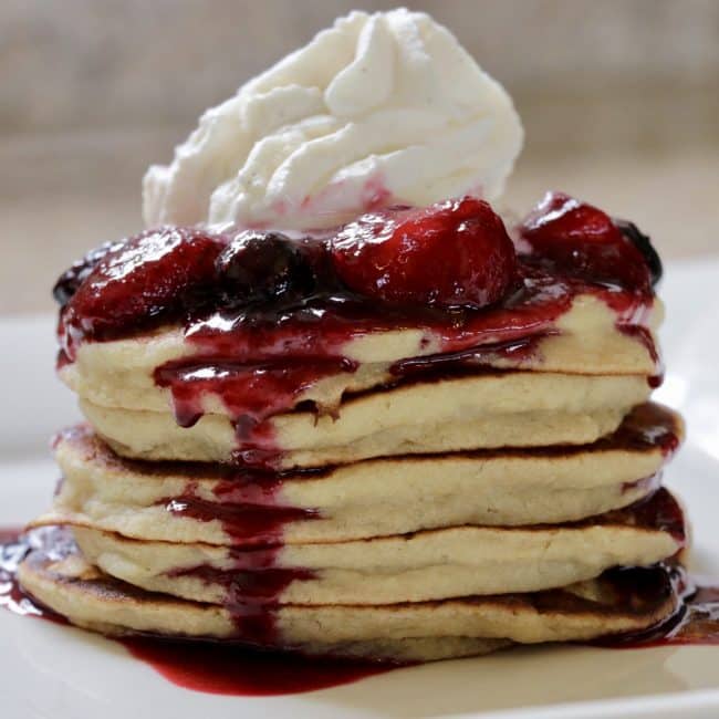 Delicious Banana Pancakes with Mixed Berry Compote and Chantilly Cream