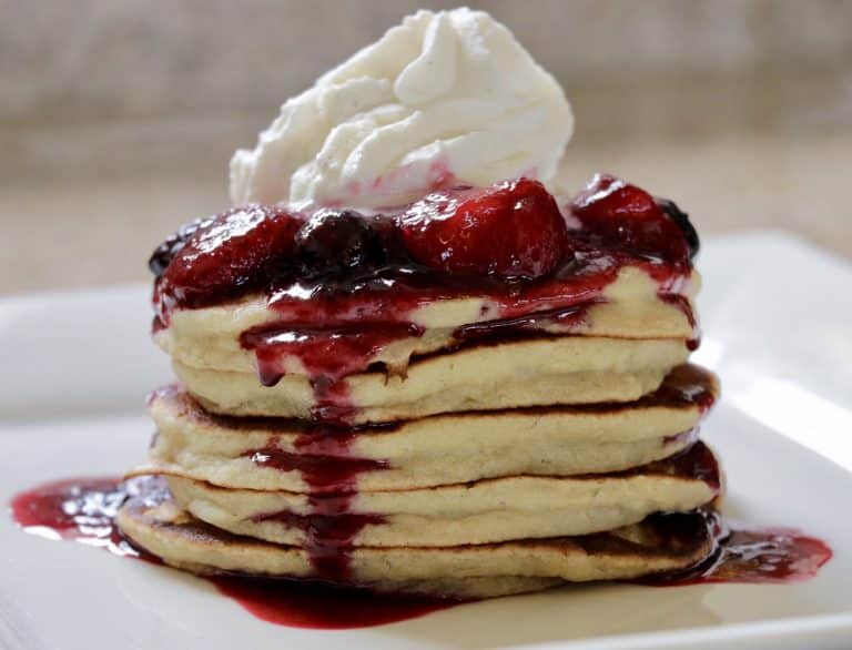 Delicious Banana Pancakes with Mixed Berry Compote and Chantilly Cream